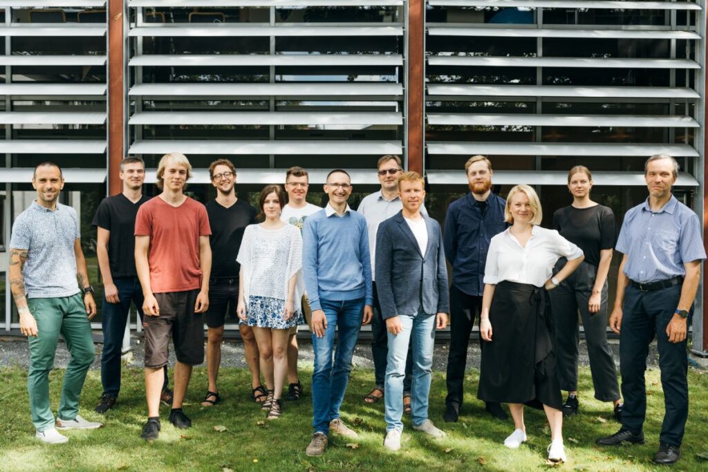 group of people standing outside of office