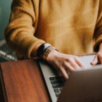 Woman typing in laptop