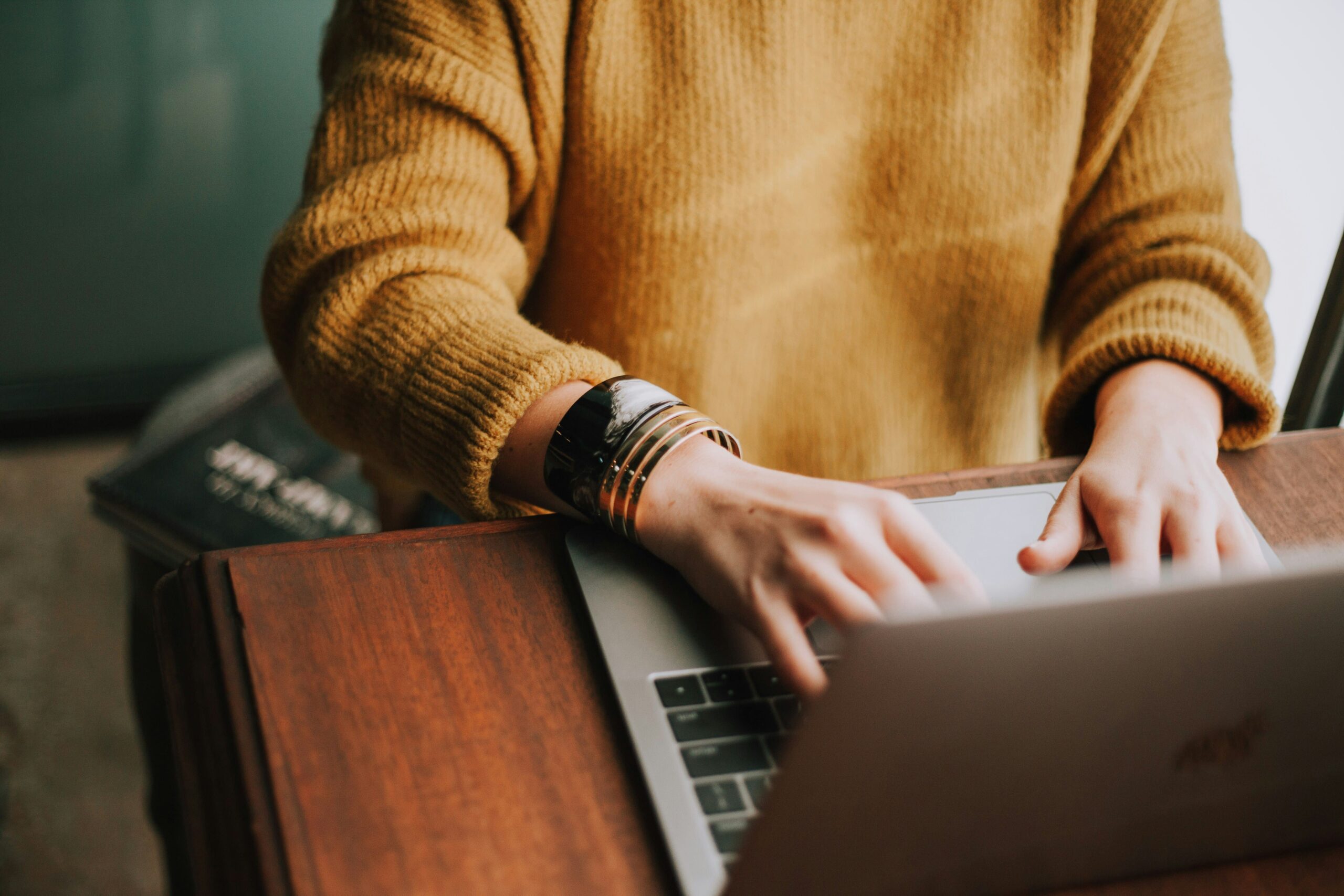 Woman typing in laptop